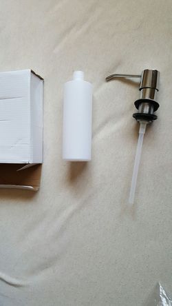 Brand new soap dispenser in box.