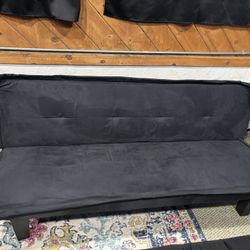 2 Black Futons With Cushioned Covers
