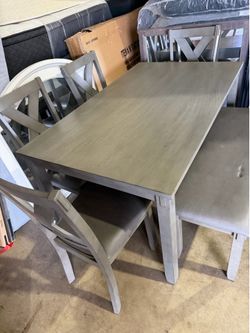 New table with 4 chairs and bench for $499