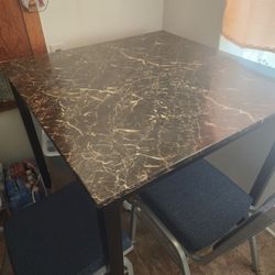 Table And Four Chairs