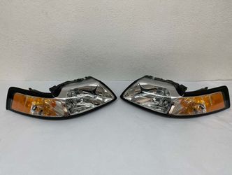 99-04 FORD MUSTANG CHROME HOUSING AND CLEAR WITH AMBER HEADLIGHTS