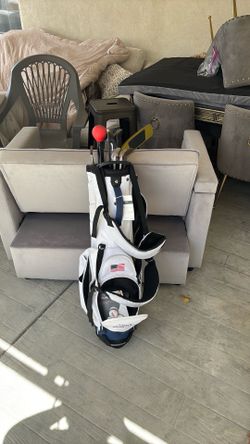 Golf bag with clubs and extras