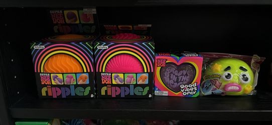 NeeDoh Ripples, Groovy Heart NeeDoh, and one SMUSHER
