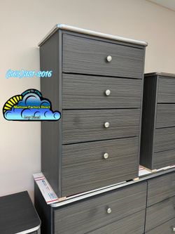 Four drawer grey compressed with silver trim Nuevo new