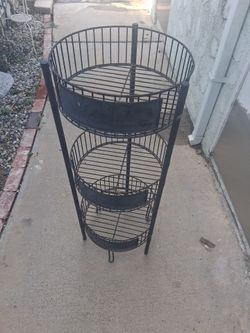 Metal stand for indoor or outdoor use
