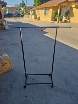 Rolling Clothes Rack with Adjustable Bar