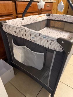 Portable playyard/ crib