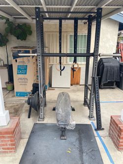 Power Rack with Barbell, Weights, and Bench