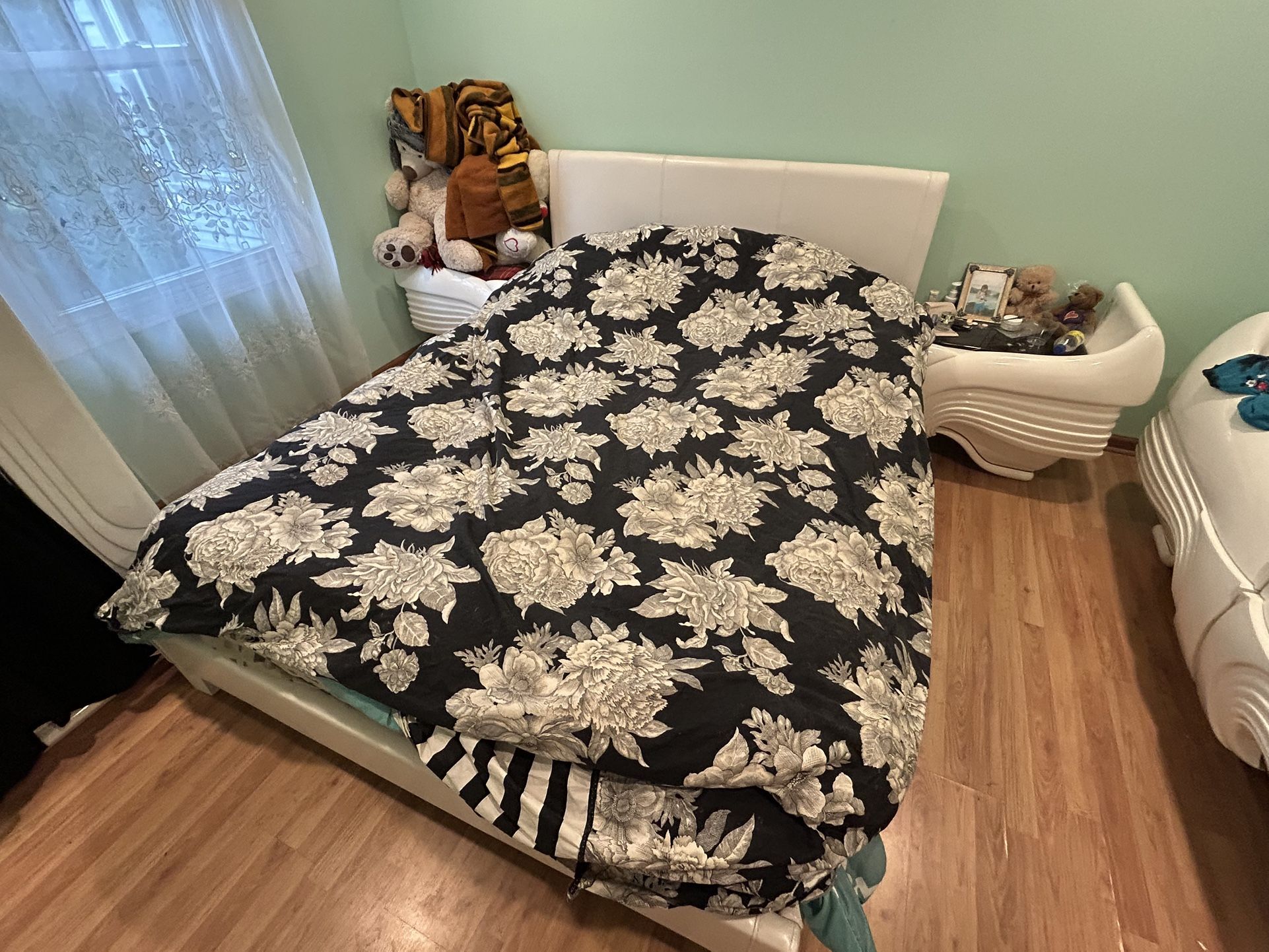 Queen White Bed Frame with Floral Bedding