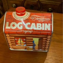 Vintage log cabin syrup tin