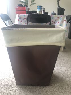 Clothes storage bin with lots of hangers
