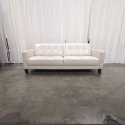 White Leather Tufted Two-Cushion Sofa with Wood Legs