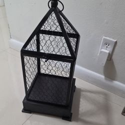 Rustic brown metal candle lantern with mesh design, measures 23 inches high x 9 inches wide