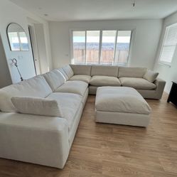 Extra large, deep seated Ashley sectional sofa with matching oversized ottoman.