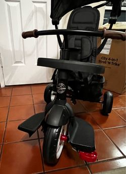 Radio Flyer City 4-in-1 Stroll 'N Trike, for Riders 1-5 Years Old, Black
