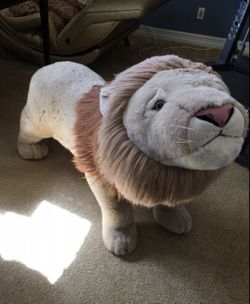 Stuffed “Ride On” Lion