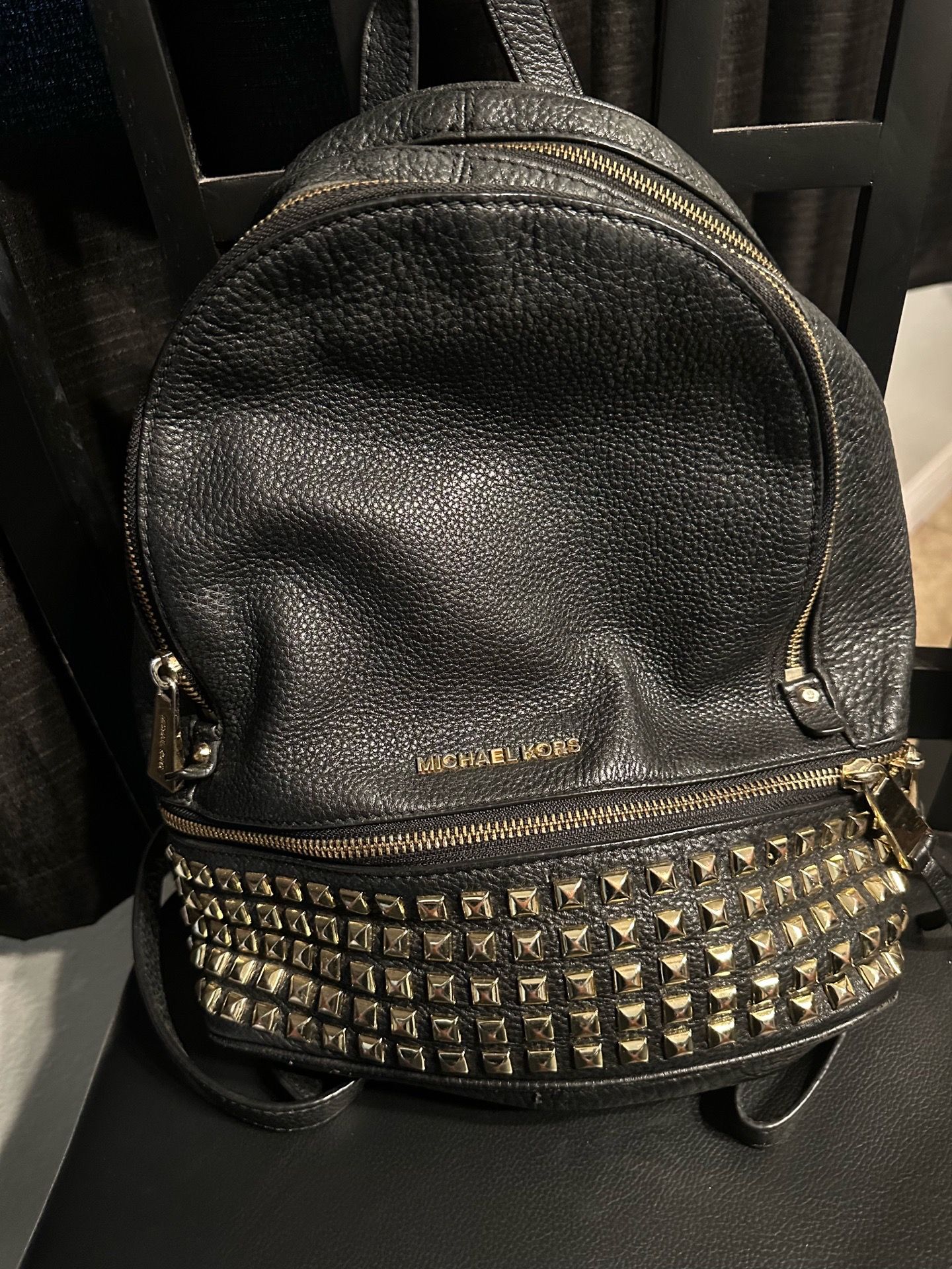 MK black and gold backpack with studded bottom
