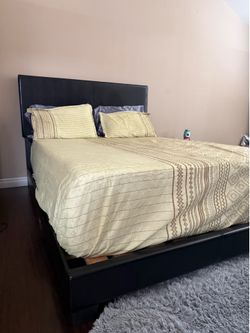 Queen size bed frame with faux leather headboard