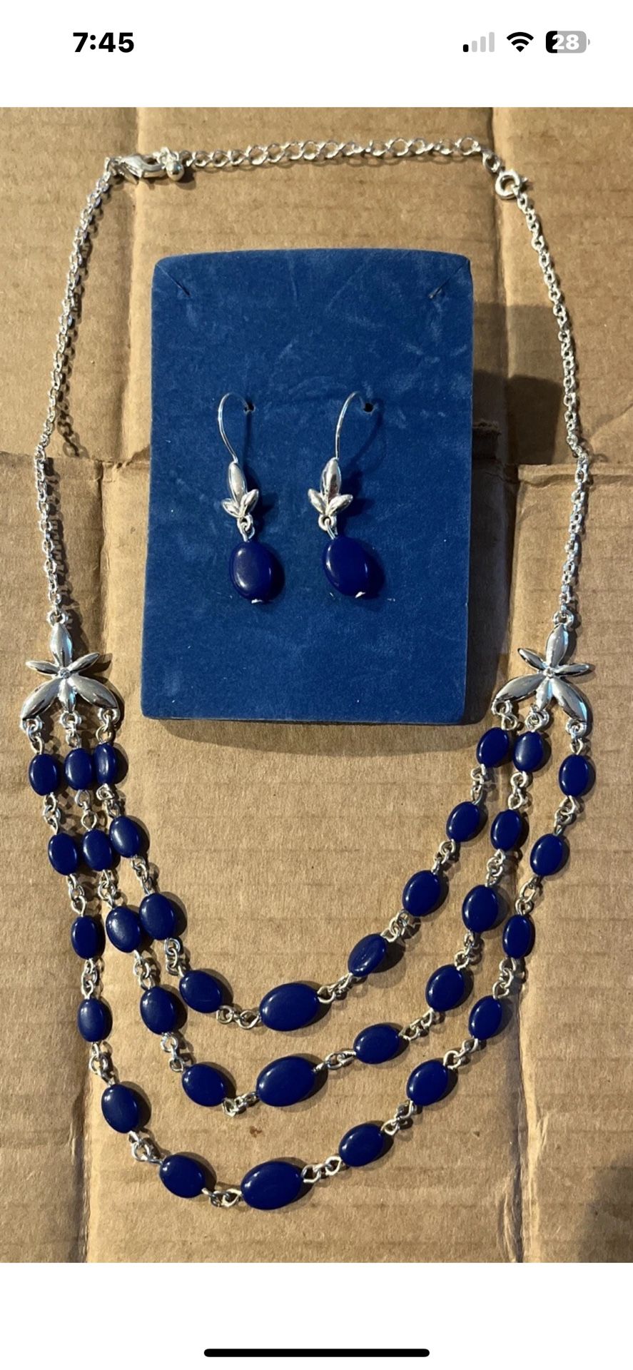 Blue beaded and silver toned necklace and earring set.