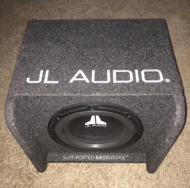 Like new JL audio 10" sub in factory ported and slotted box had it in my Audi wagon and this speaker slaps lika mufuka
