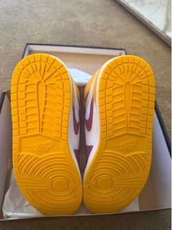 Jordan• 1 Retro High OG in University Gold, Light Bordeaux