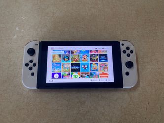 NINTENDO SWITCH V2 with 125 SWITCH GAMES MARIO PARTY,MARIO KART,POKEMON,ZELDA,MINECRAFT and More