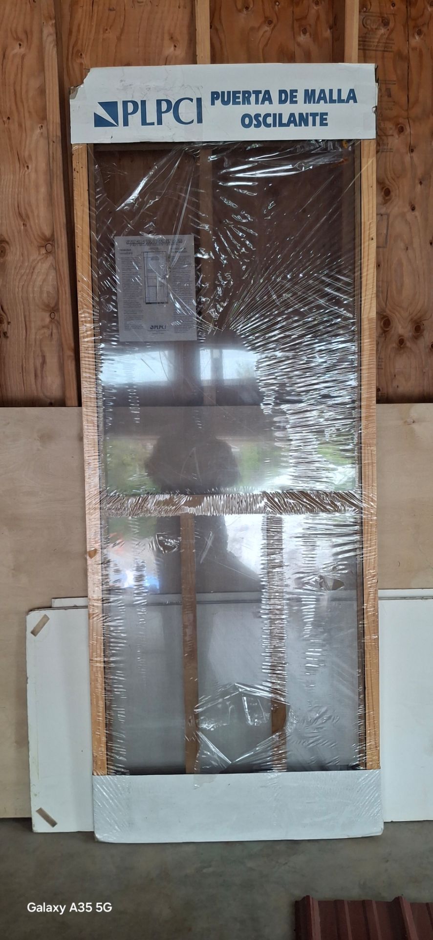Unused wood screen door
