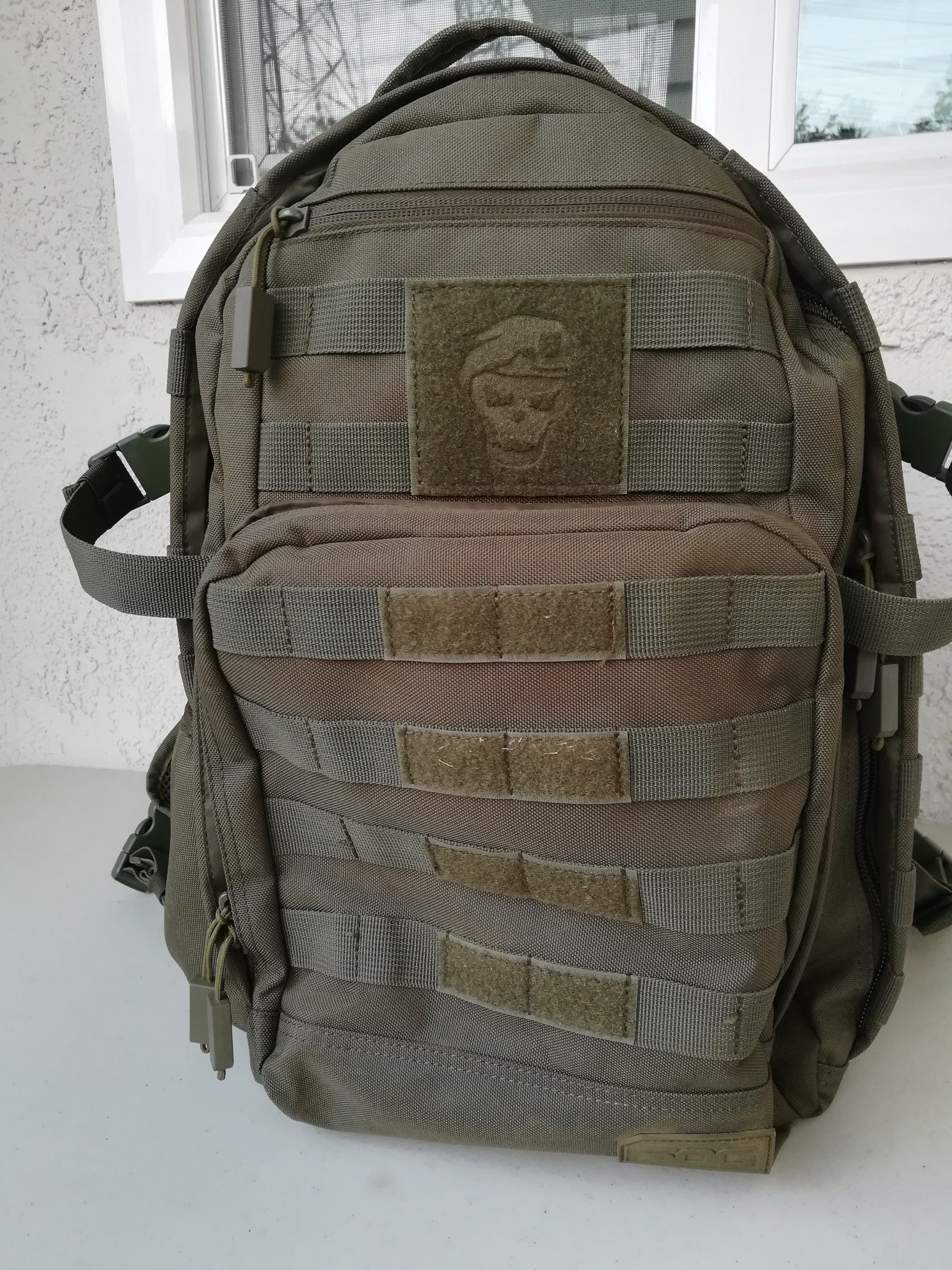 Used SOG Ninja Tactical Day Pack, 24.2 L with One Tigris Drawstring Water Bottle Holder