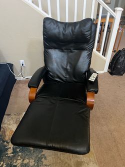 Black leather massage chair