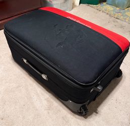 Moving sale large suitcase with two wheels