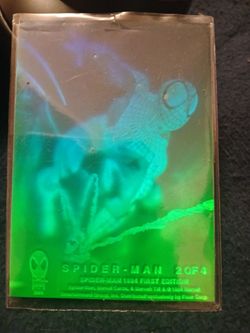 All hologram . (1 )1994  Fleer spiderman 2-4 (1) spiderman Fleer 4-4 and a Carnage 1-1fleer hologram card and (2) Thing super heroes hologram cards