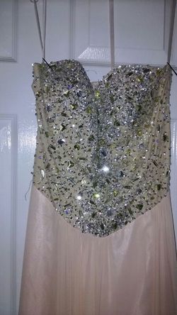 Hand embroidered strapless gown. Bottom skirt connected is a blush pink