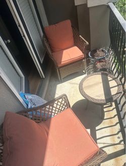 Outdoor seats (2) and table