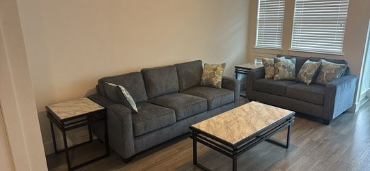 Sofa and loveseat with coffee and end tables
