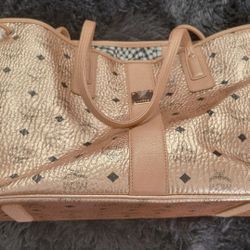 Gold MCM tote bag.