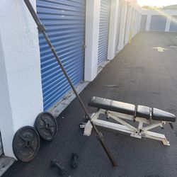 Weights and cage style squat, rack, bench press, lap pull down
