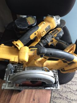Dewalt grinder circular saw hammer drill, jigsaw(not shown yet), battery, battery charger, and drill bits.