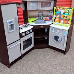 KIDS WOODEN PLAY KITCHEN WITH SOME NEW PLAY KITCHEN ITEMS 