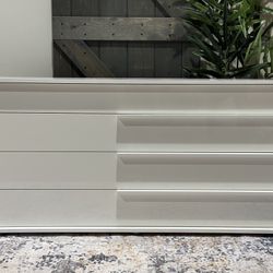 Mckie 4 - Drawer Dresser in glossy white. 30'' H X 60'' W X 21'' D Manufactured Wood MSRP $2080. Our price $1352 + sales tax   