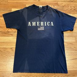 America dark blue fadded vintage t shirt  Size Large  Small rips at the arm pits
