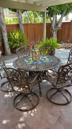 Wrought iron table and 6 chairs