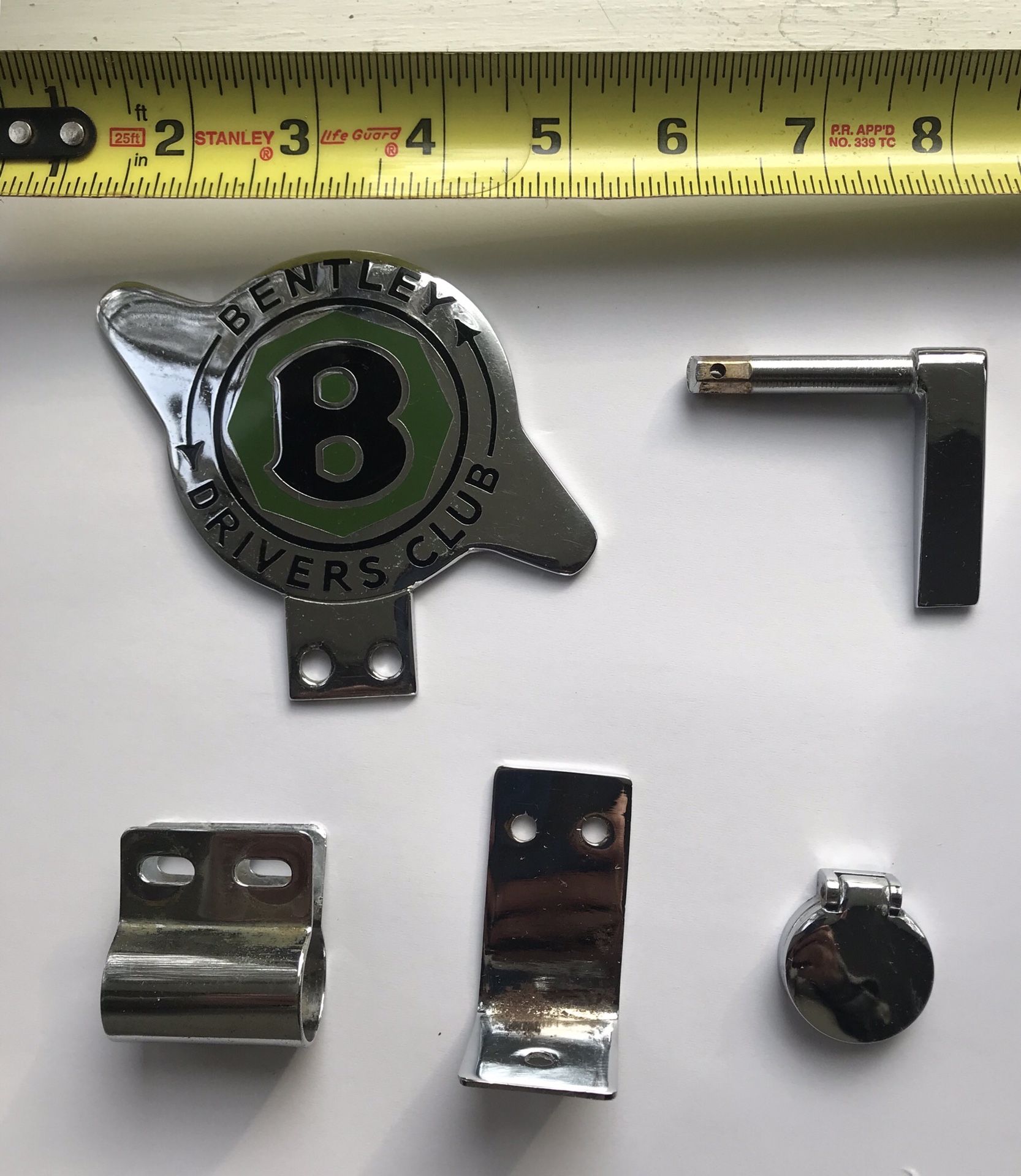 Vintage Bentley automobile badge, other accessories