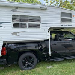 Cozy, Fully-Equipped Truck Camper: Queen Bed, Dual Showers & More! 