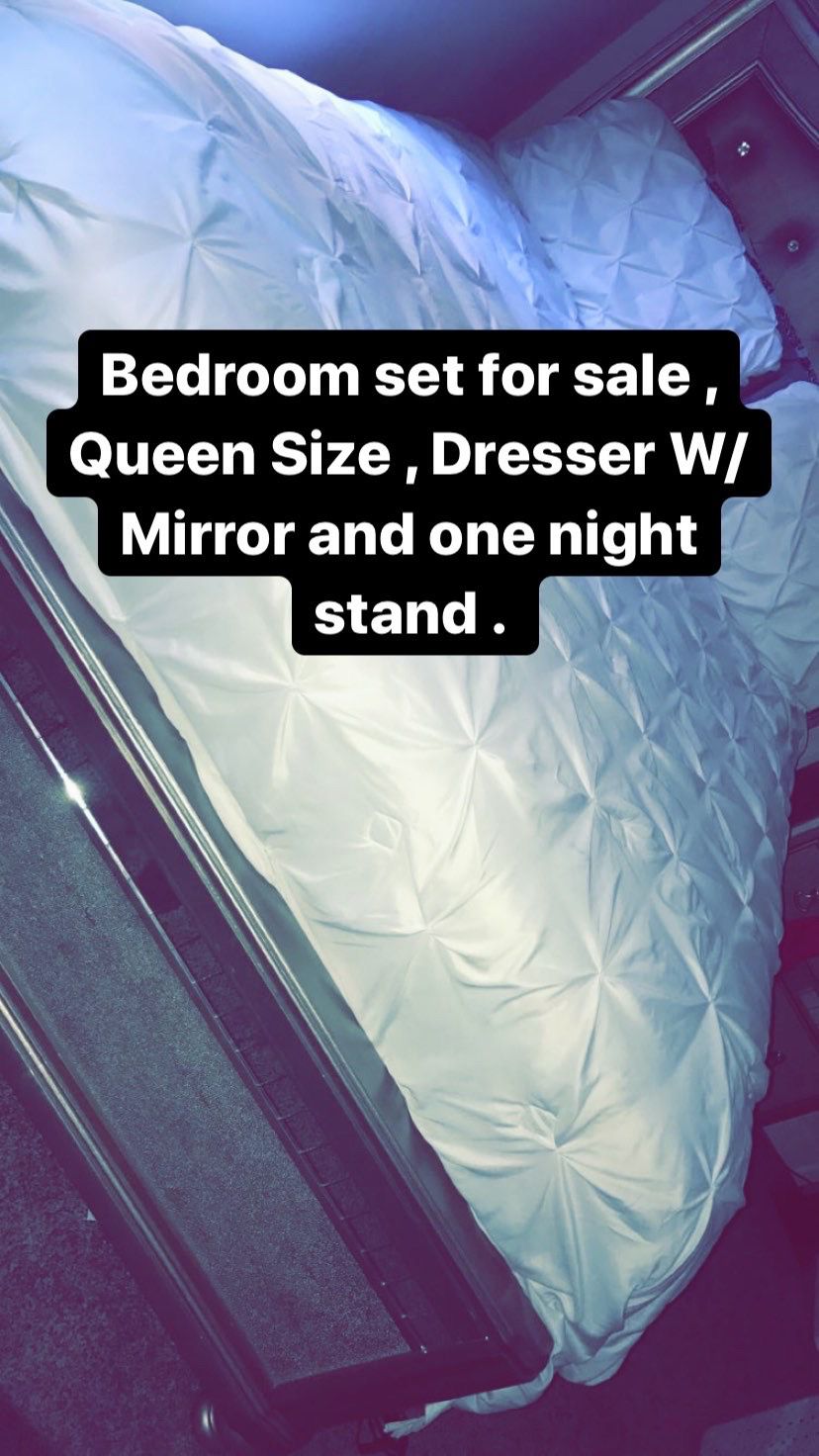 Queen size bedroom set . Dresser with mirror and one night stand .