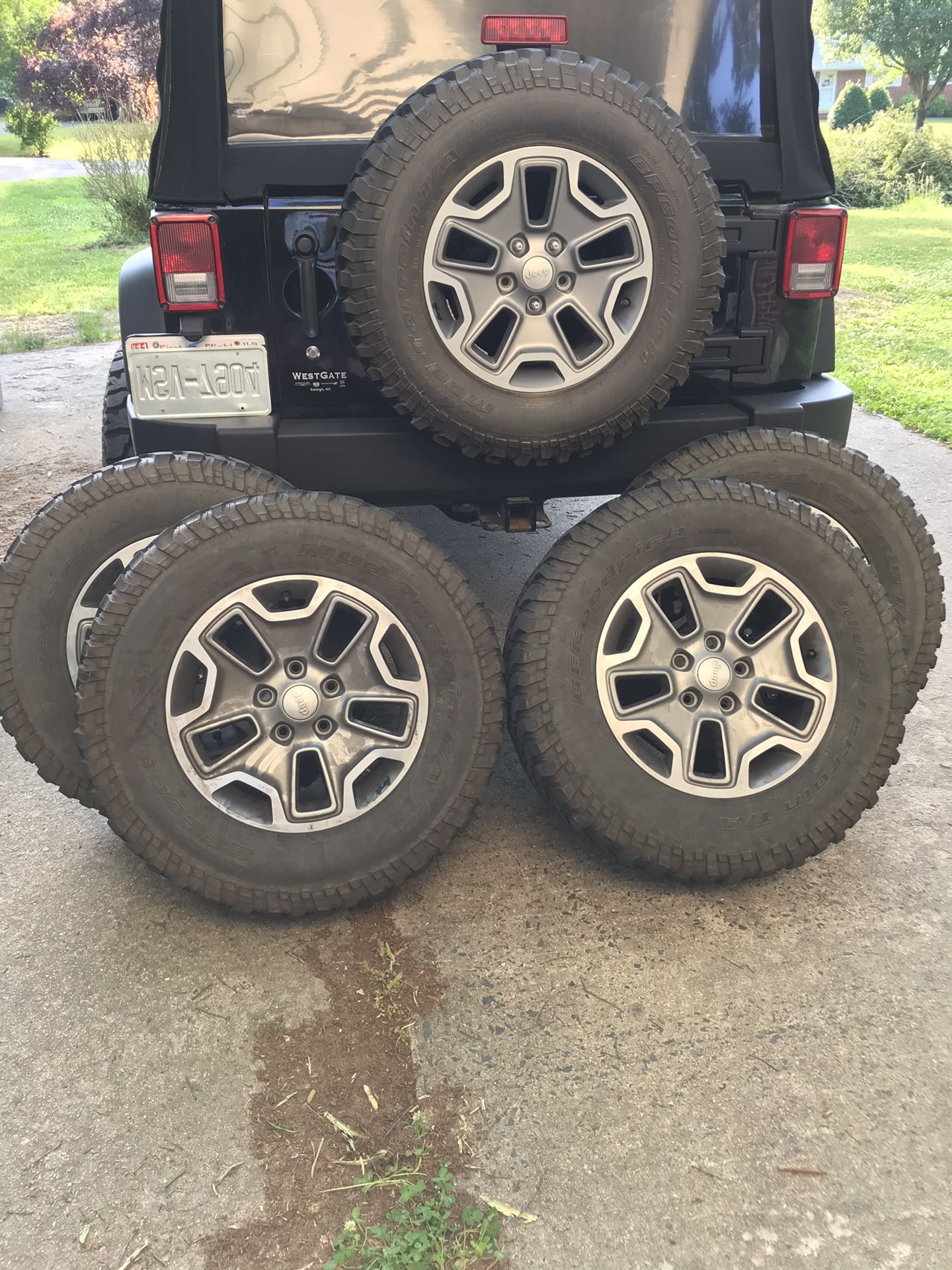 Jeep Wrangler tires and wheels 255/75R17 spare tire is brand new . The other 4 tires have about 60 % tread on them .