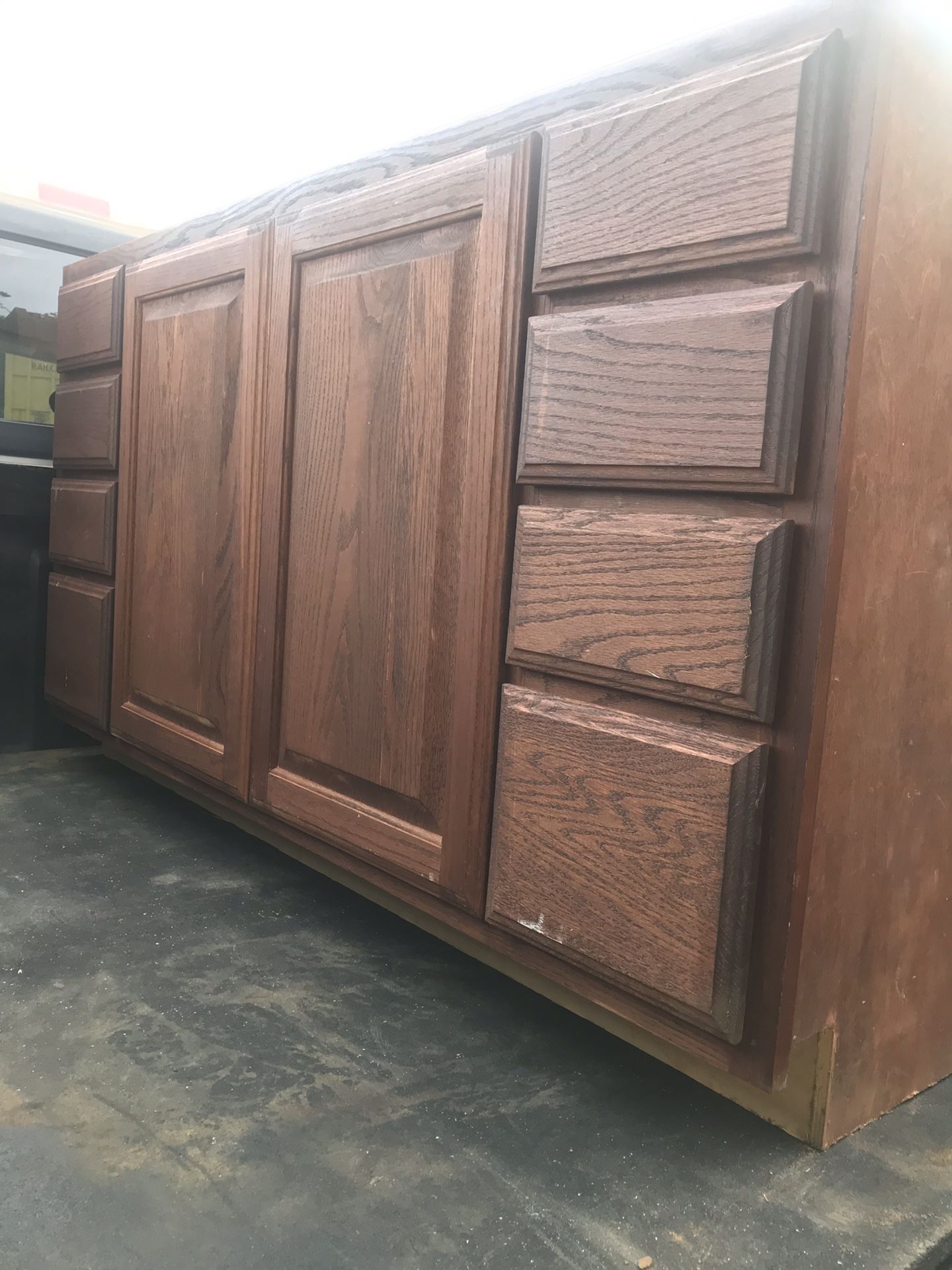 Mahogany brown cabinet with White stove top and island For kitchen