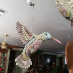 Porcelain hummingbird wind shine.I paid $50 for each mood.I want two hundred dollars for the wind