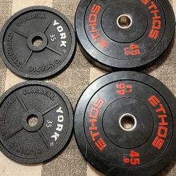 ETHOS Olympic Rubber Bumper Plate And  York Barbell Cast Iron Olympic Plate Sets.