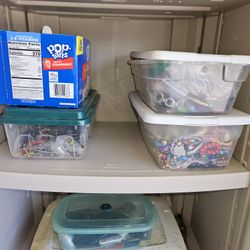 Tubs full of assorted jewelry