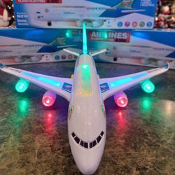 New kid's flashing electric airplane rolls light's up makes noise. 